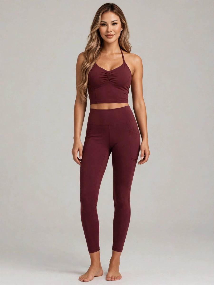 Model wearing the burgundy ruched halter activewear set
